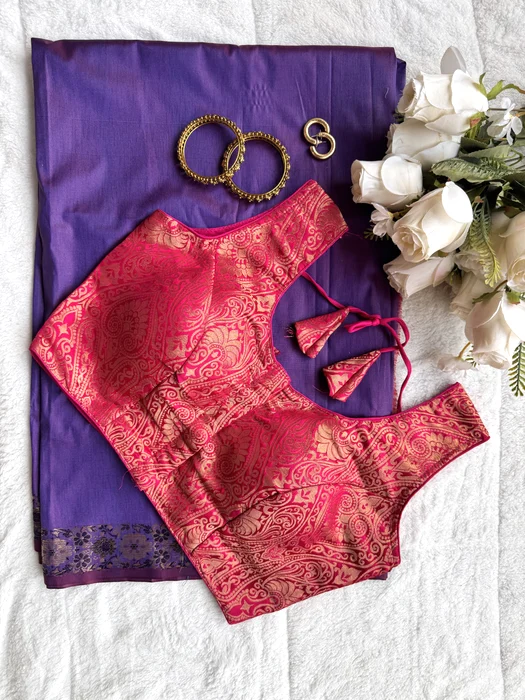 Vastram Stories blouse styled on a purple saree with bangles and roses