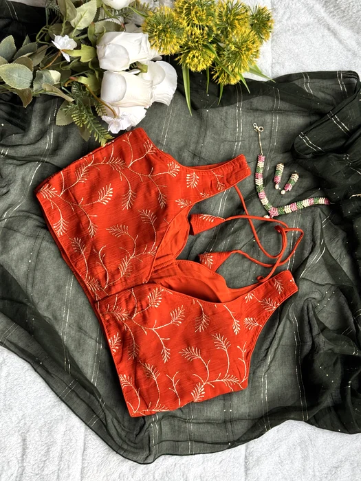 Vastram Stories blouse styled on a green georgette saree with flowers